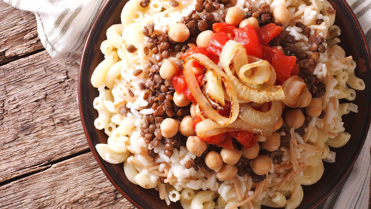 <strong>Koshary: </strong>Koshary is a combination of macaroni, rice and beans flavored with tomatoes, onions, garlic and whatever else the chef feels like tossing in. 