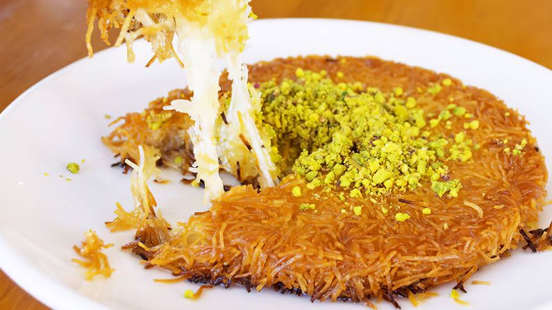 <strong>Konafa: </strong>Konafa<strong> </strong>revolves around thin, noodle-like pastry soaked in syrup, stuffed with creamy cheese and often topped with nuts.