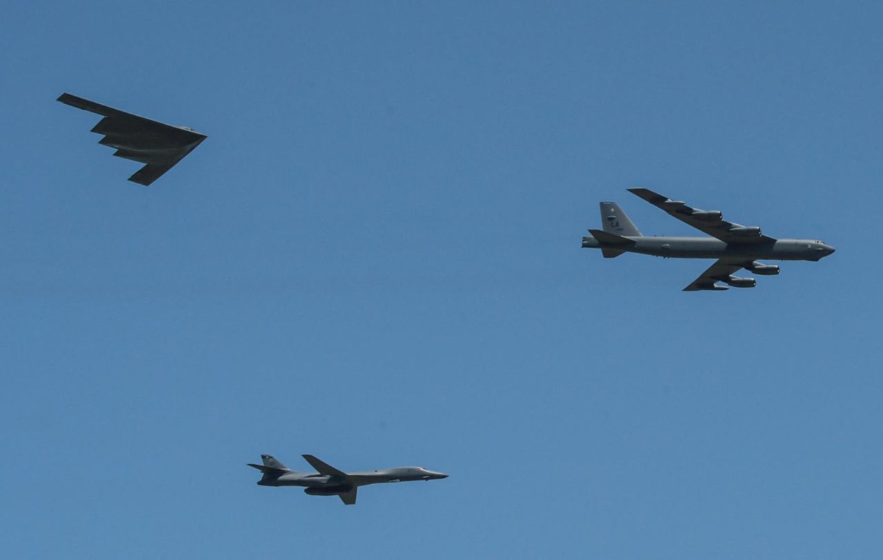 A B-1 Lancer, a B-2 Spirit and a B-52 Stratofortress perform a flyover at Barksdale Air Force Base.