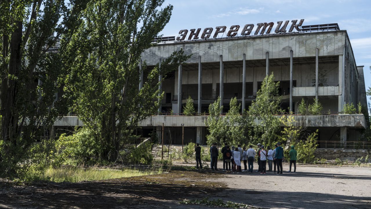 Tourists are guided around the abandoned city of Pripyat, inside the Chernobyl exclusion zone, in 2019. 