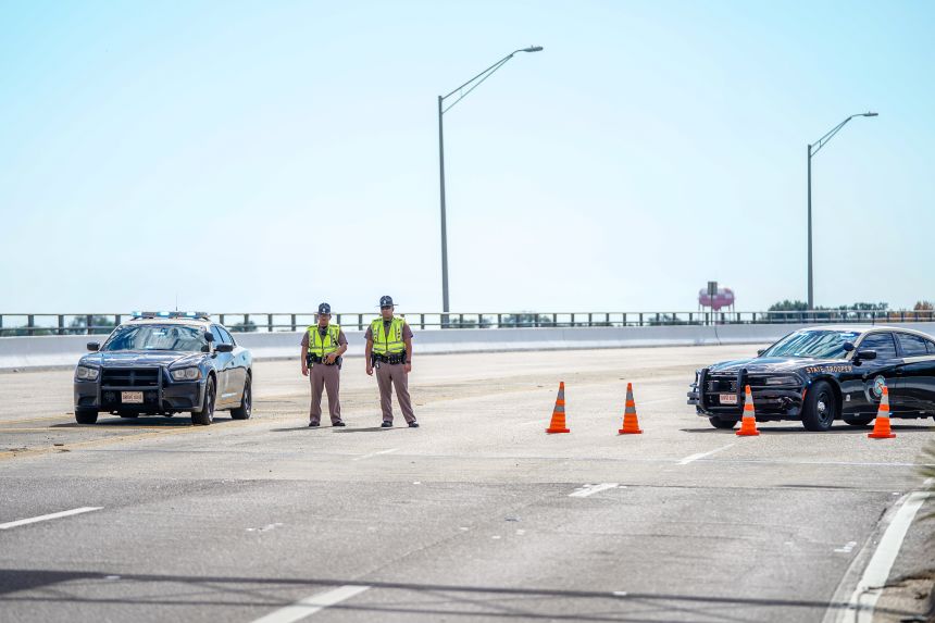 PENSACOLA, FLORIDA - DECEMBER 06: Florida State Troopers block traffic over the Bayou Grande Bridge leading to the Pensacola Naval Air Station following a shooting on December 06, 2019 in Pensacola, Florida. The second shooting on a U.S. Naval Base in a week has left three dead plus the suspect and seven people wounded. (Photo by Josh Brasted/Getty Images)