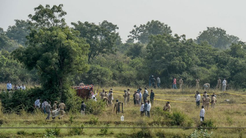 Police personnel gather near the site where they shot dead four detained gang-rape and murder suspects in Shadnagar on December 6, 2019. - Indian police on December 6 shot dead four detained gang-rape and murder suspects as they were re-enacting their alleged crime, prompting outrage but also wild celebrations. (Photo by Noah SEELAM / AFP) (Photo by NOAH SEELAM/AFP via Getty Images)