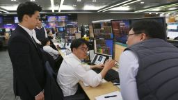 Currency traders work at the foreign exchange dealing room of the KEB Hana Bank headquarters in Seoul, South Korea.