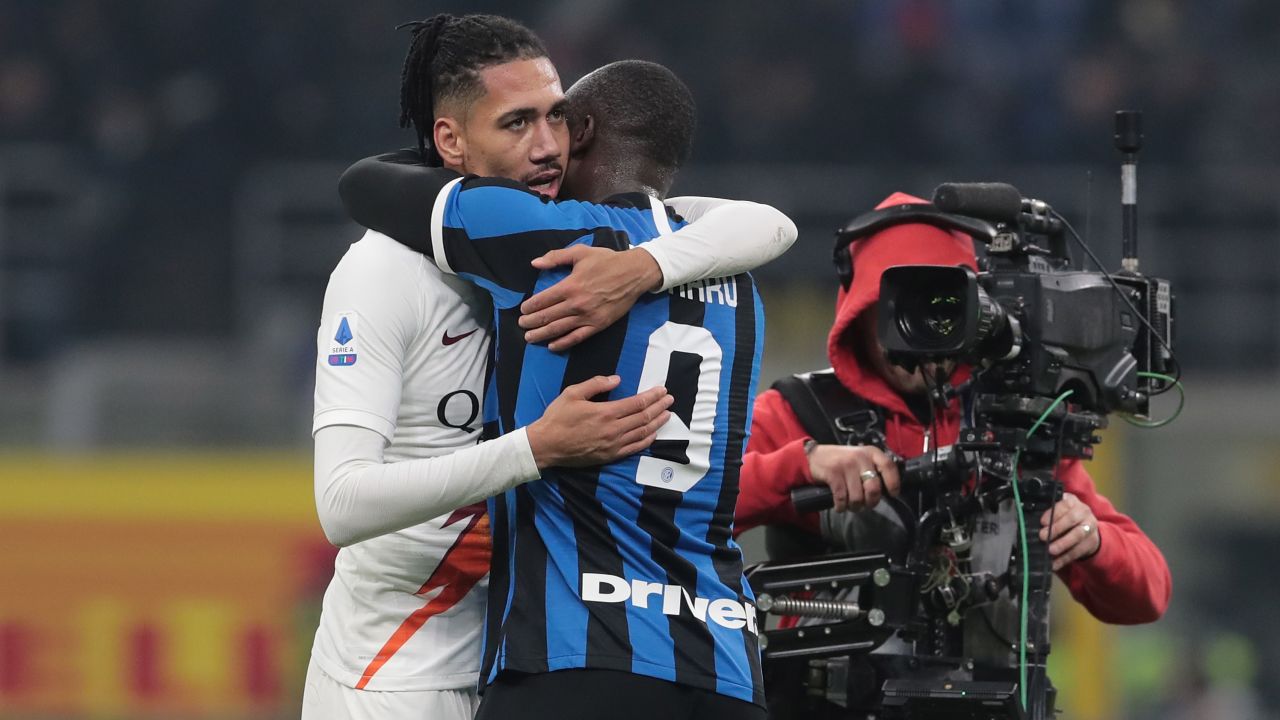 Chris Smalling of AS Roma embraces Romelu Lukaku of FC Internazionale. Smalling and Lukaku played for Manchester United last season.