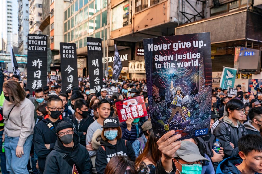 Pro-democracy protesters march on December 8 in Hong Kong.