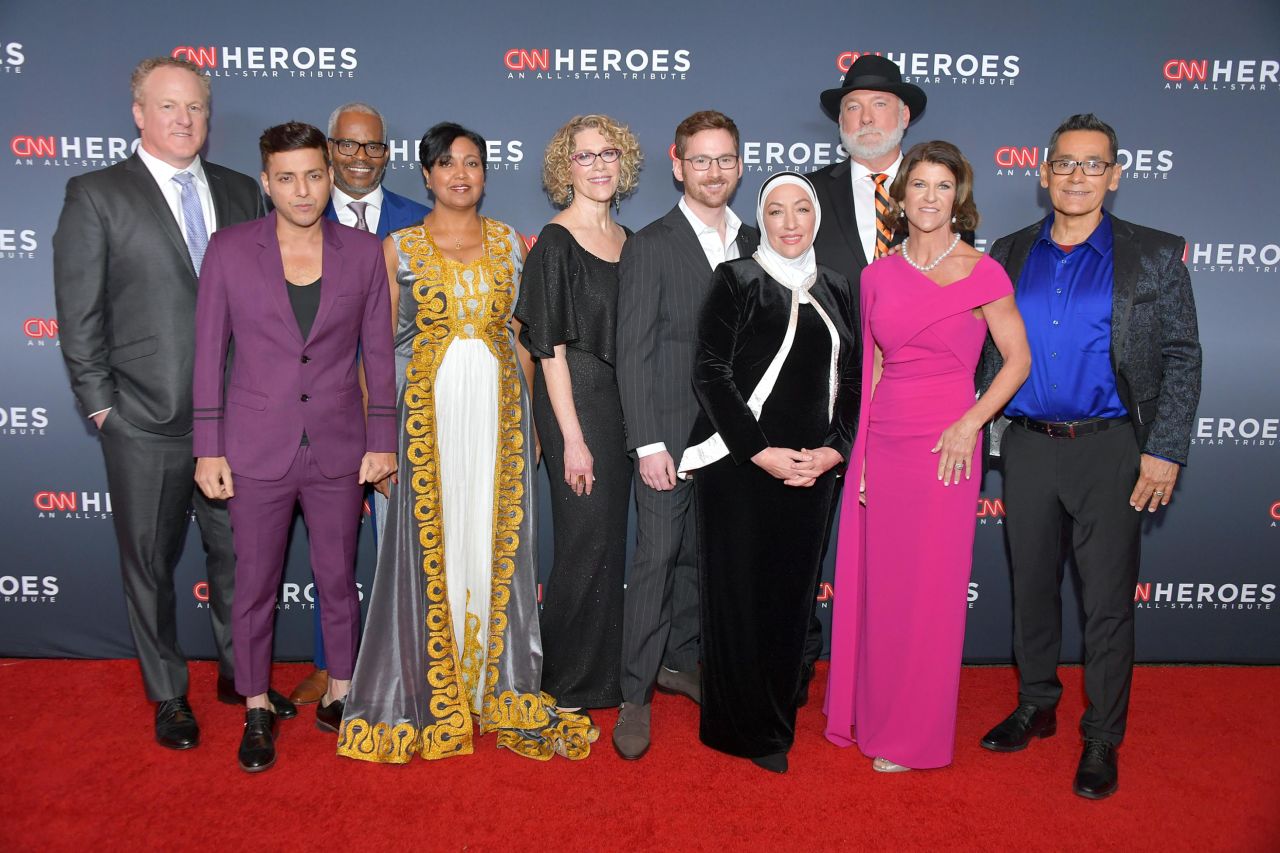 From left, the 2019 Top 10 CNN Heroes Woody Faircloth, Afroz Shah, Richard Miles, Freweini Mebrahtu, Mary Robinson, Zach Wigal, Najah Bazzy, Mark Meyers, Staci Alonso, and Roger Montoya arrive on the red carpet at the American Museum of Natural History on Sunday, December 8.