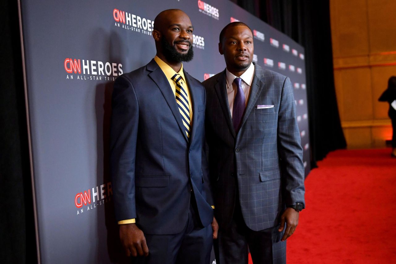 Student athlete Nathan Bain and a guest pose on the red carpet at the American Museum of Natural History on Sunday, December 8.