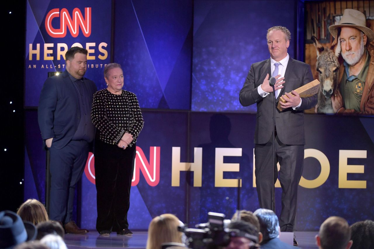 Woody Faircloth accepts his award onstage. Faircloth was honored by actress Kathy Bates and actor Paul Walter Hauser from the upcoming film "Richard Jewell."