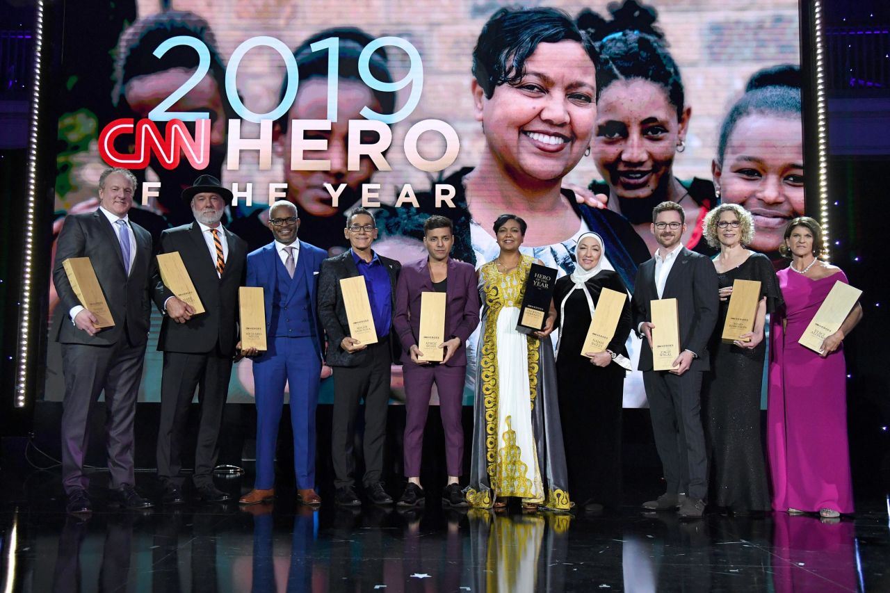 From left, the Top 10 2019 CNN Heroes Woody Faircloth, Mark Meyers, Richard Miles, Roger Montoya, Afroz Shah, Freweini Mebrahtu, Najah Bazzy, Zach Wigal, Mary Robinson, and Staci Alonso pose onstage at American Museum of Natural History on Sunday, December 8.