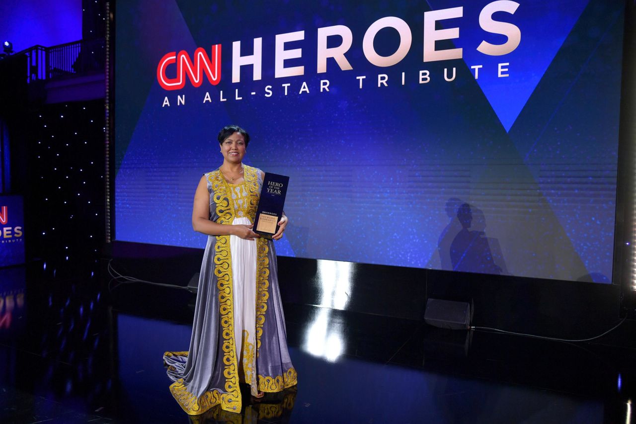 The 2019 CNN Hero of the Year Freweini Mebrahtu poses with her award after the show. Mebrahtu was honored for her incredible work to remove the cultural stigma around periods in parts of the developing world. She designed and patented a reusable menstrual pad in 2005, and she and her team produce 750,000 reusable pads a year at her factory in Ethiopia. Nearly 800,000 girls and women have benefited from her work.