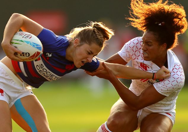 Joanna Grisez of France is tackled by Celia Ounssah of England during day one of the HSBC World Rugby Sevens Series in Dubai on Thursday, December 5. 
