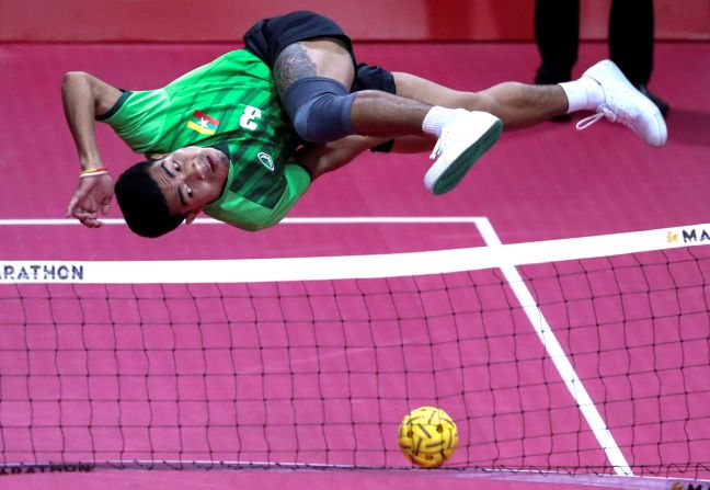 Myanmar's Naing Aung Myo competes in a Sepak takraw, or kick volleyball, match against Laos in Olongapo. Philippines, on Wednesday, December 4. 