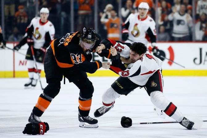 Ottawa Senators' Nick Paul and Philadelphia Flyers' Jakub Voracek fight during an NHL hockey game on Saturday, December 7.