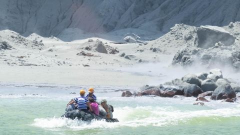 Rescuers evacuate people from the island, minutes after the volcano erupted.