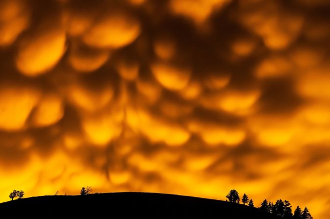 Mammatus clouds -- formed when downward currents collide with rising warm air -- seen after a sunset in Wyoming, USA. 