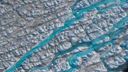 ILULISSAT, GREENLAND - AUGUST 04: In this view from an airplane rivers of meltwater carve into the Greenland ice sheet near Sermeq Avangnardleq glacier on August 04, 2019 near Ilulissat, Greenland. The Sahara heat wave that recently sent temperatures to record levels in parts of Europe has also reached Greenland. Climate change is having a profound effect in Greenland, where over the last several decades summers have become longer and the rate that glaciers and the Greenland ice cap are retreating has accelerated.   (Photo by Sean Gallup/Getty Images)