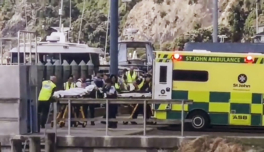 Injured from White Island volcanic eruption are ferried into waiting ambulances in Whakatane, New Zealand, Monday.