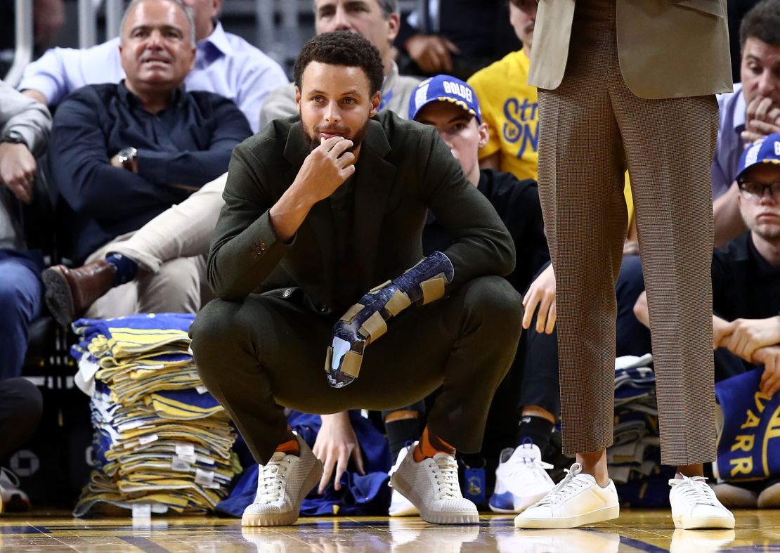 Steph Curry watches from the sidelines as Golden State loses to Oklahoma City Thunder in November. 