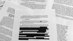 Pages from the report issued by the Department of Justice inspector general is photographed in Washington, Monday, Dec. 9, 2019. The report on the origins of the Russia probe found no evidence of political bias, despite performance failures.