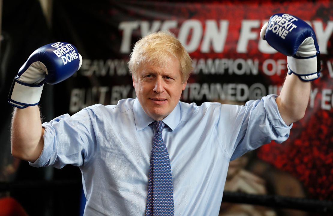 Boris Johnson wears boxing gloves emblazoned with "Get Brexit Done" during a stop in Manchester in late November. 