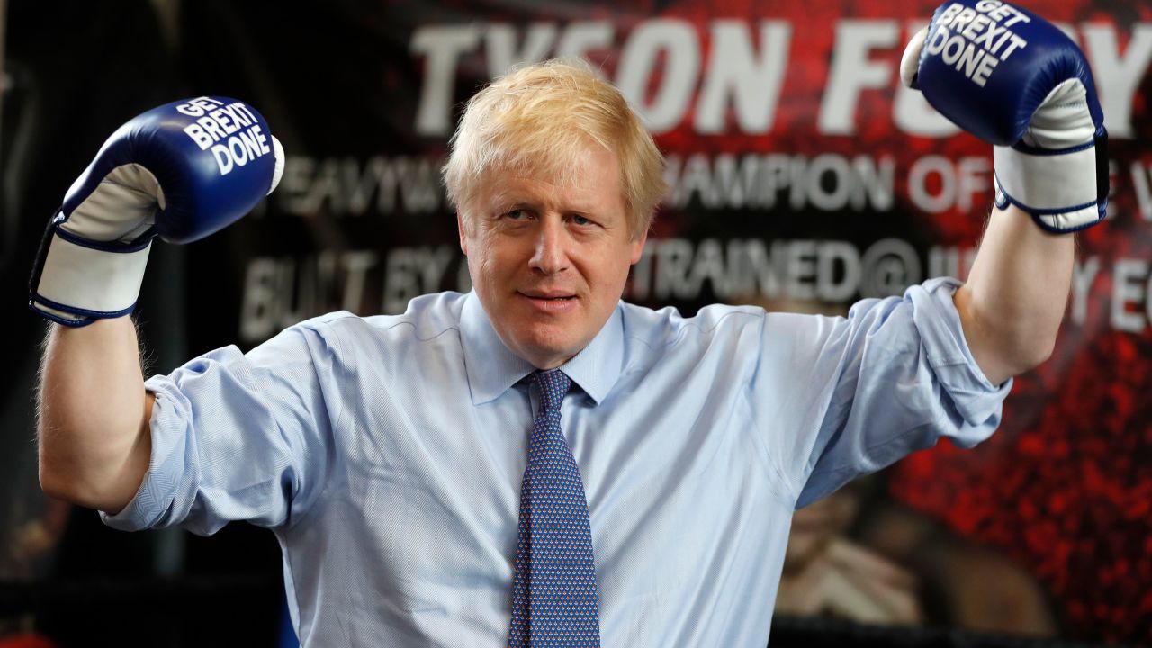 Boris Johnson wears boxing gloves emblazoned with "Get Brexit Done" during a stop in Manchester in late November. 