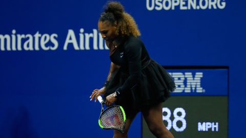 Williams carries her racket off the court during the 2018 US Open final. 