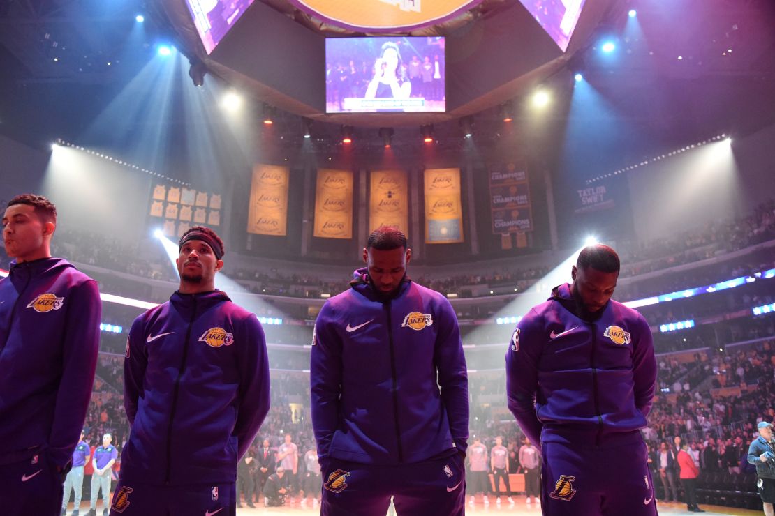 Los Angeles Lakers star LeBron James (second from right) and former Lakers forward Lance Stephenson (right) bow their heads during the National Anthem before the game against the Portland Trail Blazers on November 14, 2018.