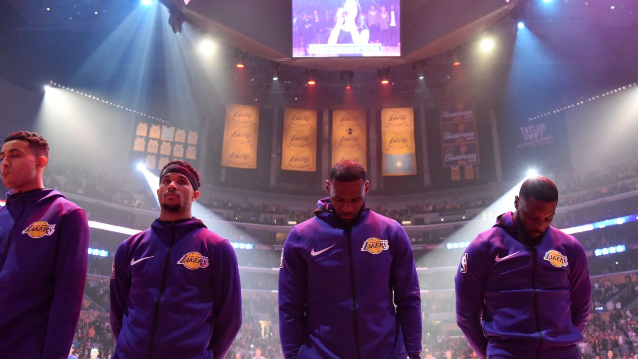 Los Angeles Lakers star LeBron James (second from right) and former Lakers forward Lance Stephenson (right) bow their heads during the National Anthem before the game against the Portland Trail Blazers on November 14, 2018.