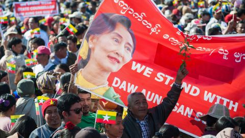 People rally in support of Myanmar State Counsellor Aung San Suu Kyi in Yangon ahead of her appearance at the International Court of Justice.