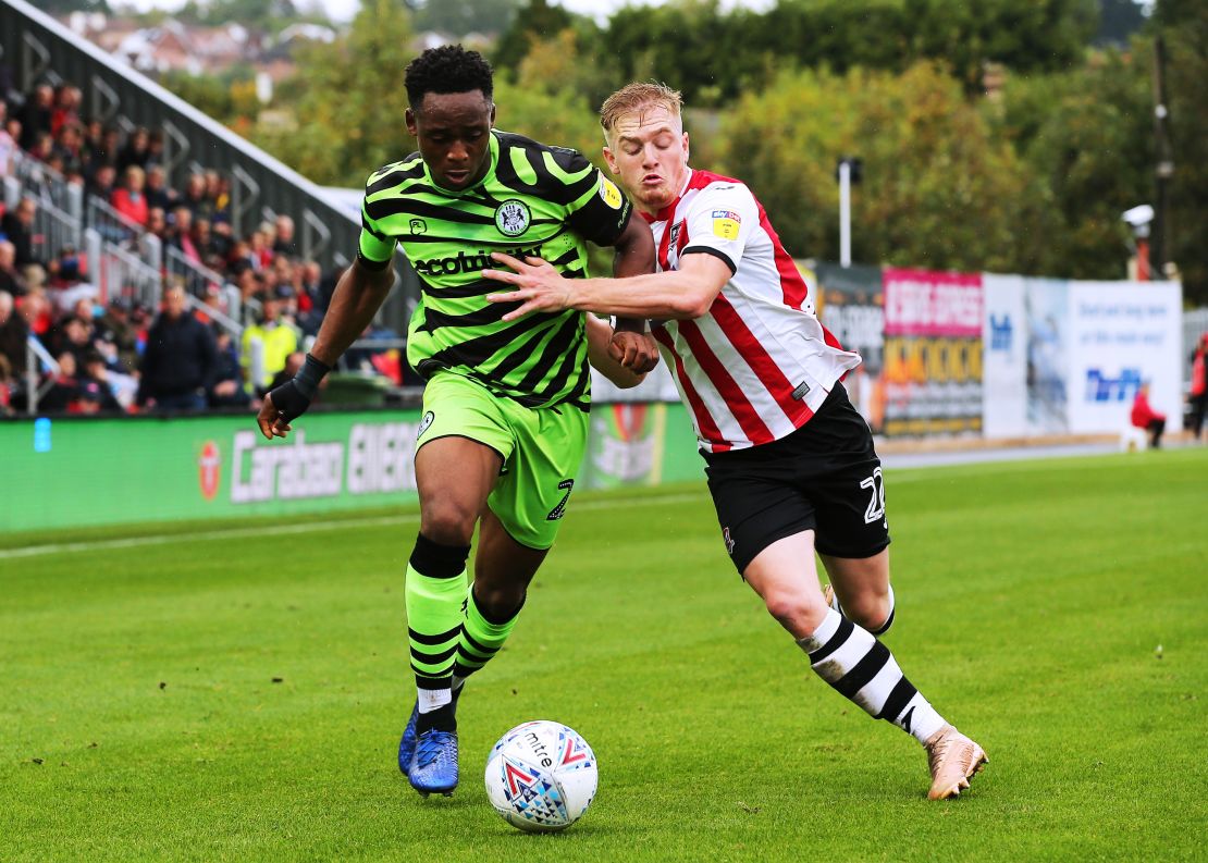 Forest Green's Udoka Godwin-Malife (left) challenges for the ball against Exeter City's Jack Sparkes during a League Two match.