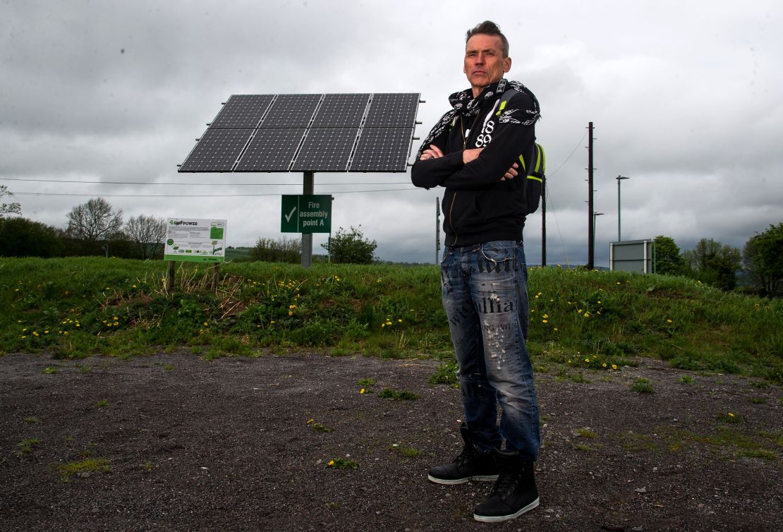 Dale Vince, chairman of Forest Green Rovers, poses next to a solar panel at the New Lawn. The Stadium is completely fulled by renewable energy.