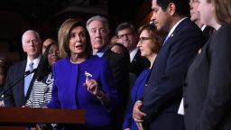 Speaker of the House Nancy Pelosi and House Ways and Means Committee Chairman Richard Neal(behind), Democrat of Massachusetts, speaks about the US - Mexico - Canada Agreement, known as the USMCA, on Capitol Hill in Washington, DC, December 10, 2019.