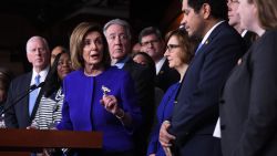 Speaker of the House Nancy Pelosi and House Ways and Means Committee Chairman Richard Neal(behind), Democrat of Massachusetts, speaks about the US - Mexico - Canada Agreement, known as the USMCA, on Capitol Hill in Washington, DC, December 10, 2019. - Officials from the US, Canada and Mexico will meet in Mexico on Tuesday for talks on a new continent-wide trade deal after President Donald Trump hinted that efforts to push the pact through the US Congress were close to success.