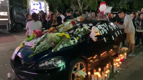 Mourners place notes and flowers on Frank Ordonez's car on Sunday, three days after he was killed in a shootout after his UPS truck was hijacked. He'd parked the car outside a UPS facility in Doral, Florida.