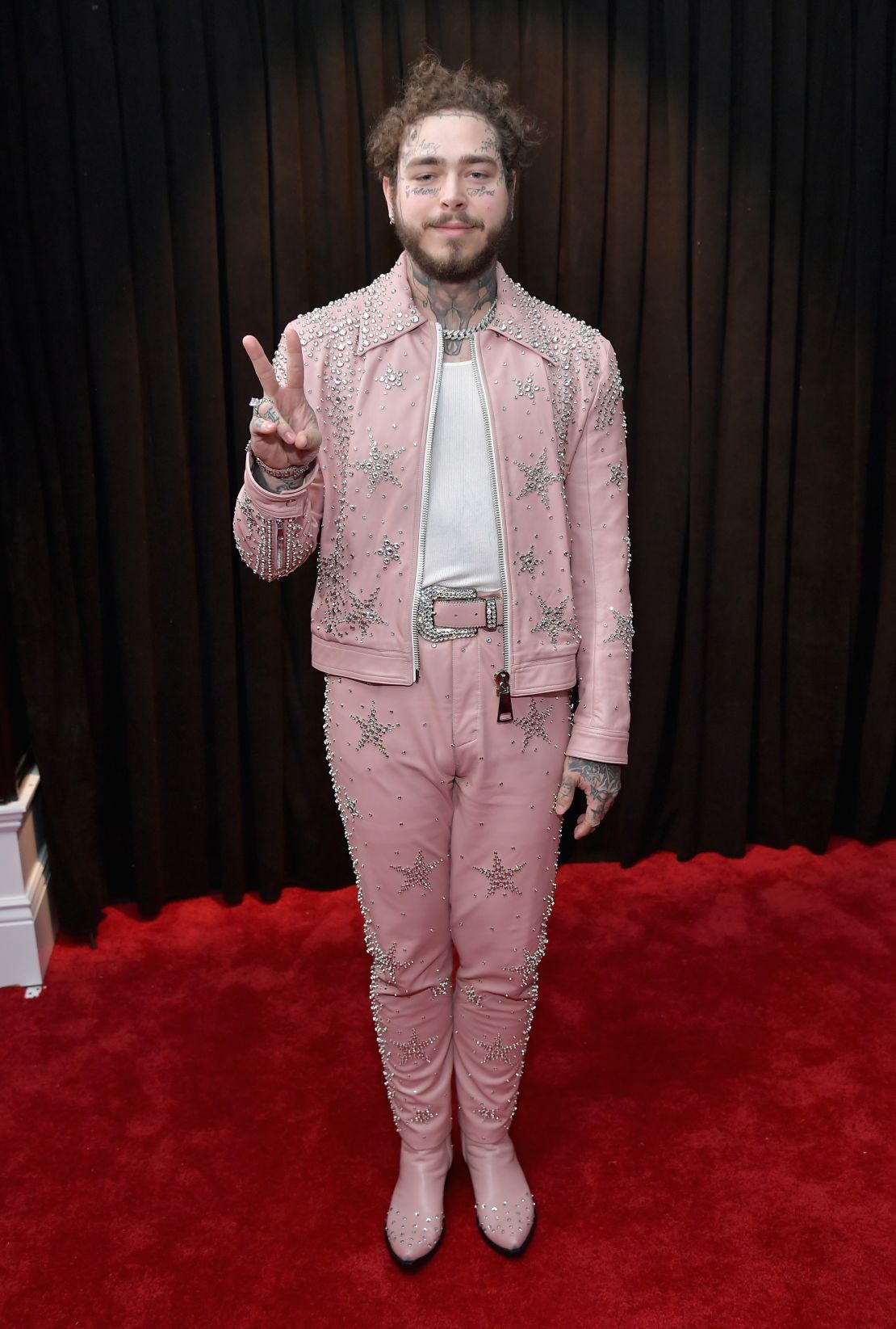 Post Malone attends the 61st Annual Grammy Awards in February wearing a rhinestone-covered leather suit.