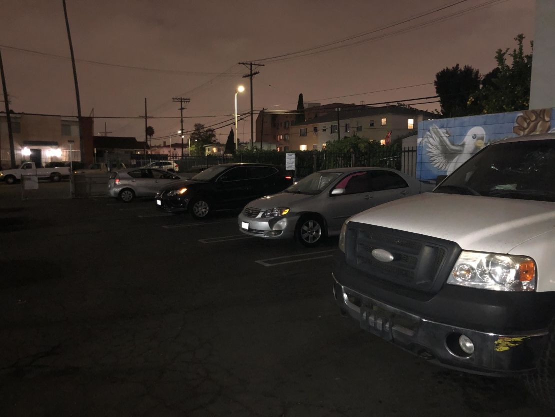 Homeless car dwellers settle in for the night at a Safe Parking LA lot in Koreatown.