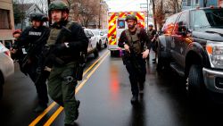 Police officers arrive at the scene following reports of gunfire, Tuesday, Dec. 10, 2019, in Jersey City, N.J.  AP Photo/Eduardo Munoz Alvarez)