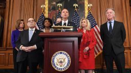 House Permanent Select Committee on Intelligence Chairman Adam Schiff (C) (D-CA), flanked by House Speaker Nancy Pelosi (L), House Judiciary Chairman Jerry Nadler (2nd L) (D-NY), House Foreign Affairs Committee Chairman Eliot Engel (R) (D-NY), House Financial Services Committee Chairwoman Maxine Waters (3rd L) (D-CA), House Committee on Oversight and Reform Chairwoman Carolyn Maloney (2nd R) (D-NY), speaks as Democrats announced articles of impeachment against US President Donald Trump during a press conference at the US Capitol in Washington, DC, December 10, 2019 listing abuse of power and obstruction of Congress. 