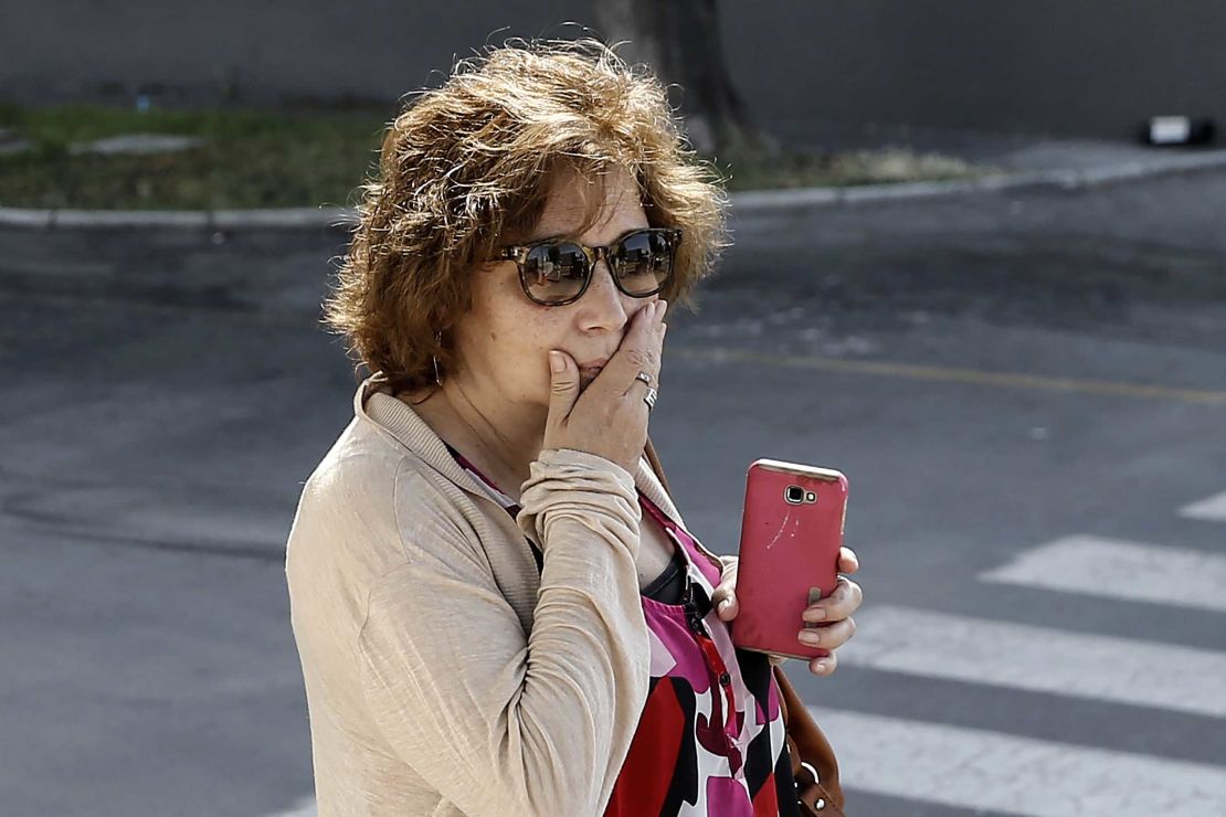 A relative of one of the plane's passengers is pictured at Cerrillos base in Santiago, Chile. 