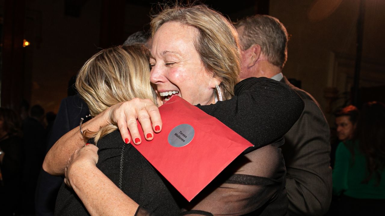 Employees at the real estate firm were shocked to find large bonuses in their surprise red envelopes.