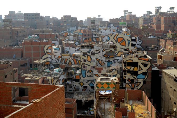 "El Seed" has created artworks across the world. This piece titled "Perception" in a Coptic Christian neighborhood of Cairo, Egypt was intended to explore the issue of discrimination against marginalized communities. The script reads "Anyone who wants to see the sunlight clearly needs to wipe his eye first."