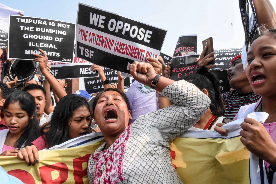 Demonstrators shout slogans as they hold placards to protest against the government's Citizenship Amendment Bill in Agartala in India's northeast state of Tripura.