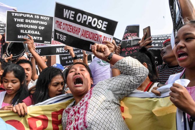 Demonstrators shout slogans during a shutdown called by the North East Students' Organization in Agartala, India, on December 10. It was hours after lawmakers approved the government's new citizenship bill.