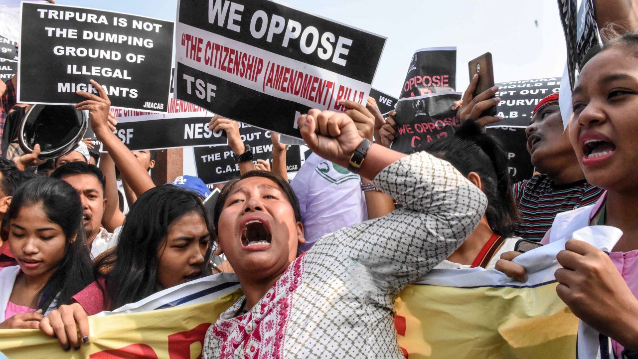Demonstrators shout slogans as they hold placards to protest against the government's Citizenship Amendment Bill in Agartala in India's northeast state of Tripura.