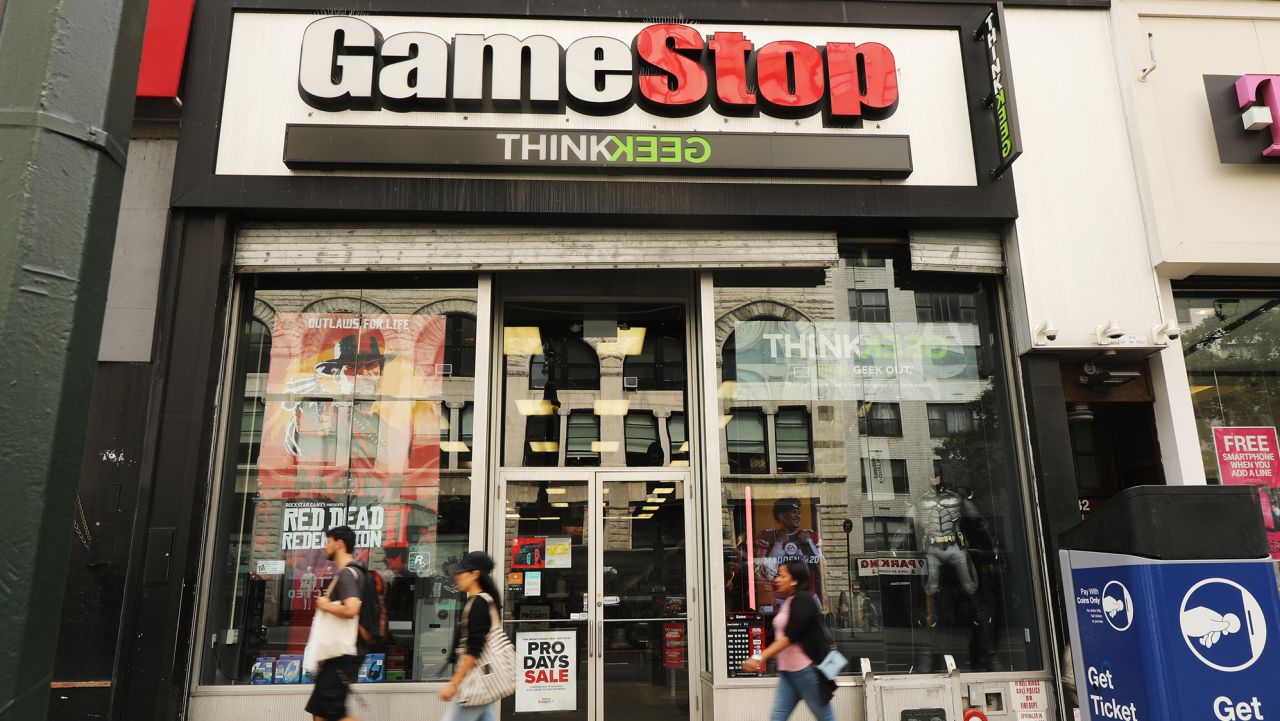 NEW YORK, NEW YORK - SEPTEMBER 16: People pass a GameStop store in lower Manhattan on September 16, 2019 in New York City. GameStop has announced that they will be closing between 180 and 200 stores before the end of the fiscal year due to a drop in sales. (Photo by Spencer Platt/Getty Images)