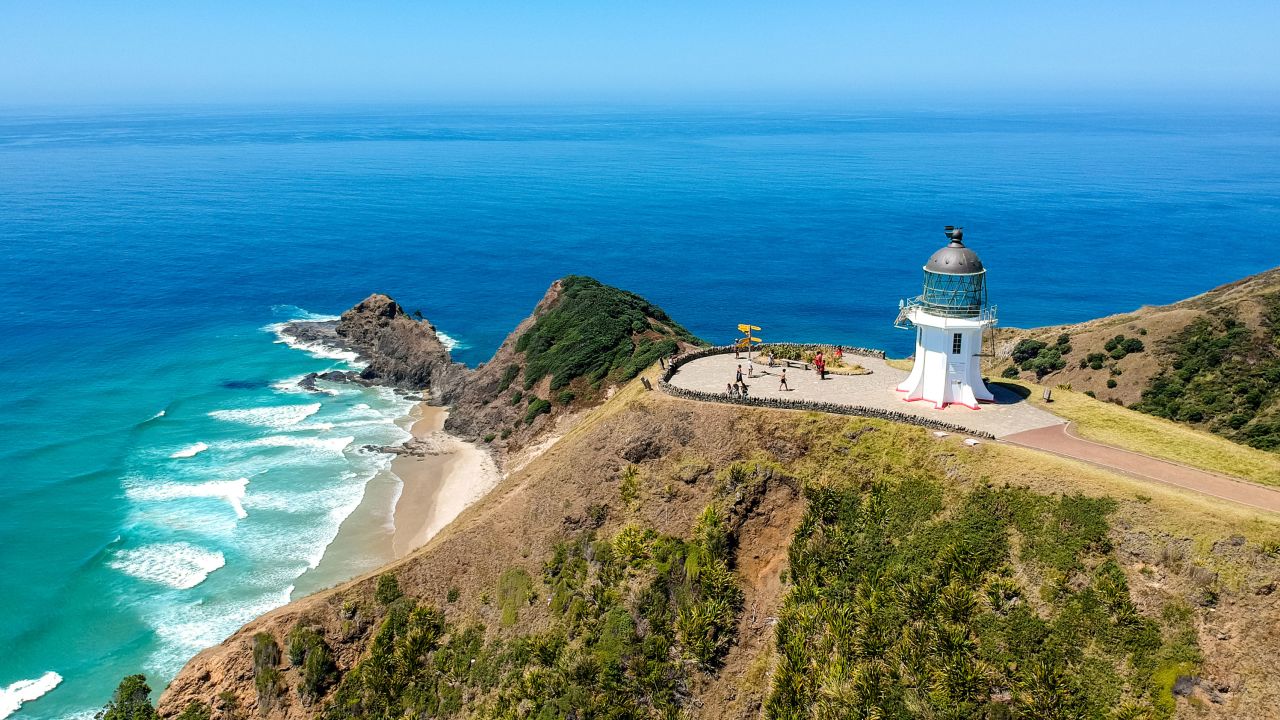 Stunning wide angle aerial drone view of Cape Reinga Lighthouse at Cape Reinga, the northernmost point of the North Island of New Zealand. The
lighthouse is a famous tourist attraction.