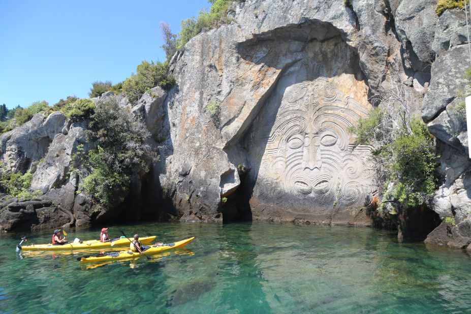 <strong>Lake Taupo: </strong>Lake Taupo and its surrounding landscapes seem like they've been purpose-built for a tourism brochure. Here, some kayakers explore Lake Taupo near Mine Bay Maori rock carvings.