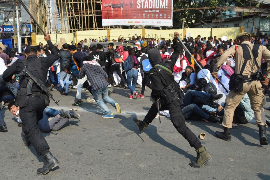 Security personnel use batons to disperse students protesting against CAB in Guwahati on December 11.