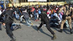 Security personnel use batons to disperse students protesting against the governments Citizenship Amendment Bill (CAB), in Guwahati on December 11, 2019. - Authorities in India's northeast called in troops on December 11 as demonstrators went on the rampage in protest at new citizenship legislation expected to pass the upper house, officials said. (Photo by Biju BORO / AFP) (Photo by BIJU BORO/AFP via Getty Images)