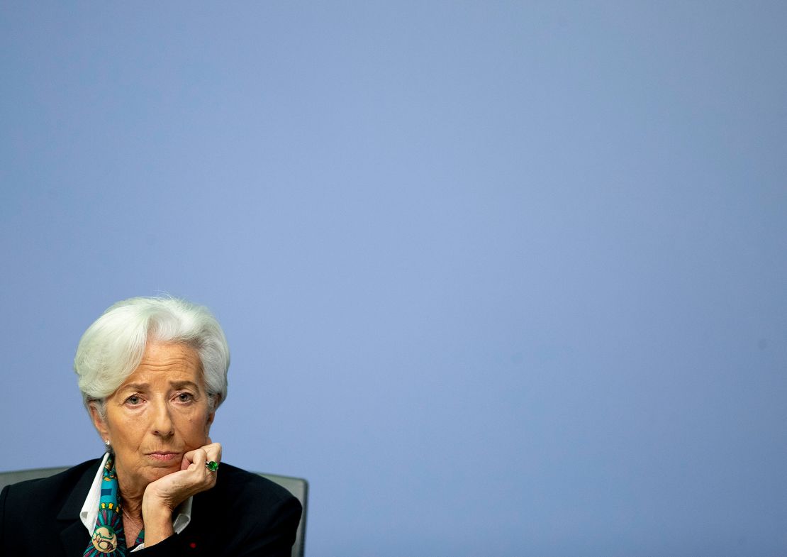 Christine Lagarde listens during a press conference.